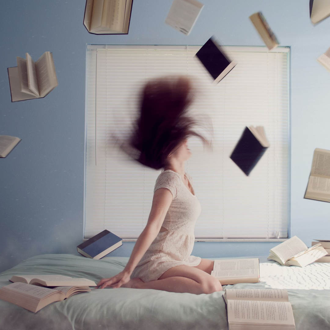 inner dimension tv personal growth blog article on how to deal with the most challenging parts of yourself symbolized by angry woman throwing books into air
